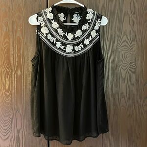 Torrid black sleeveless top with cross stitched flowers. Size Torrid 00